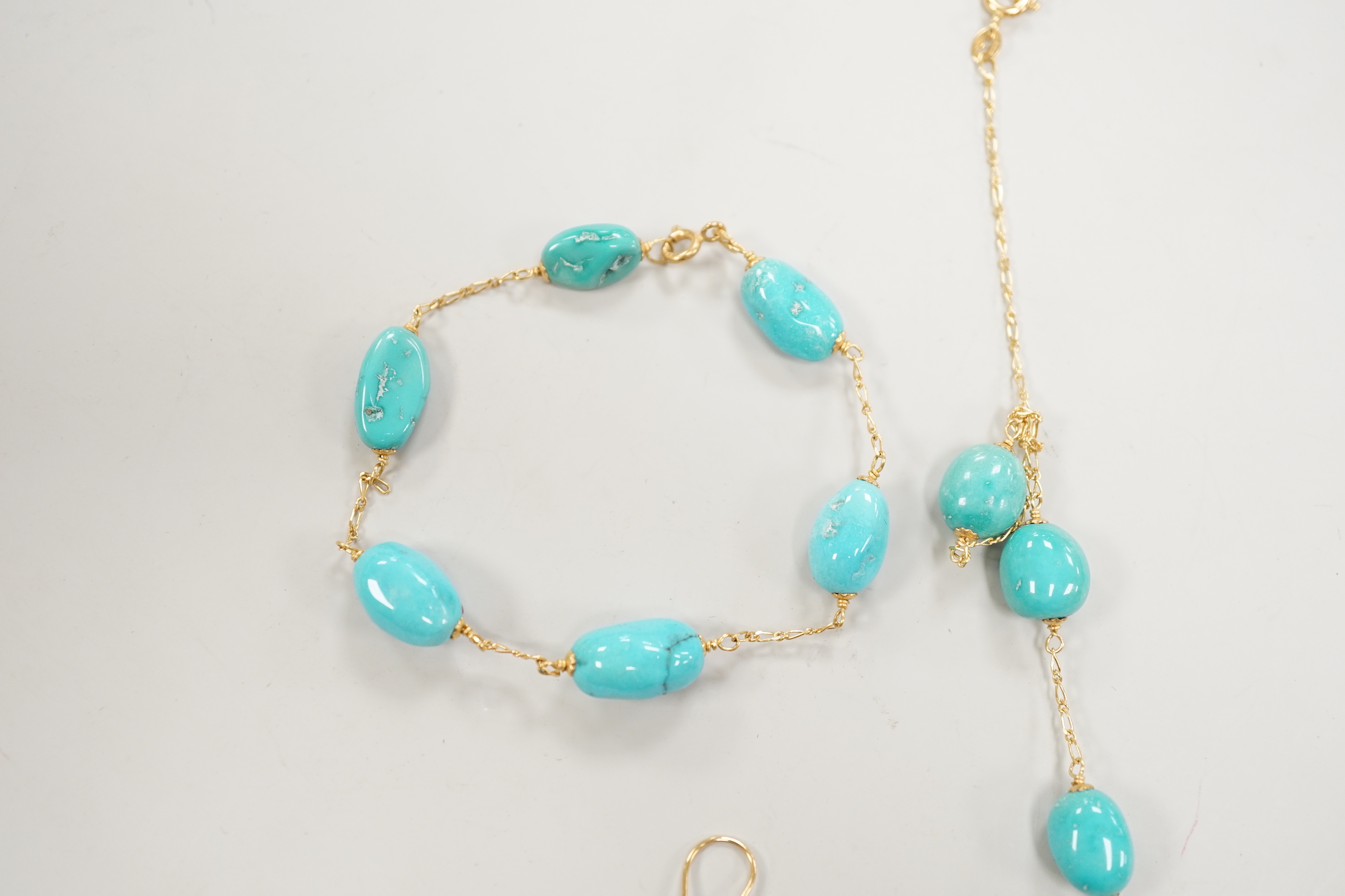 A modern Italian 750 and turquoise bead set necklace and matching bracelet, (necklace knotted) and a pair of similar enamelled? earrings, gross weight 29.4 grams.